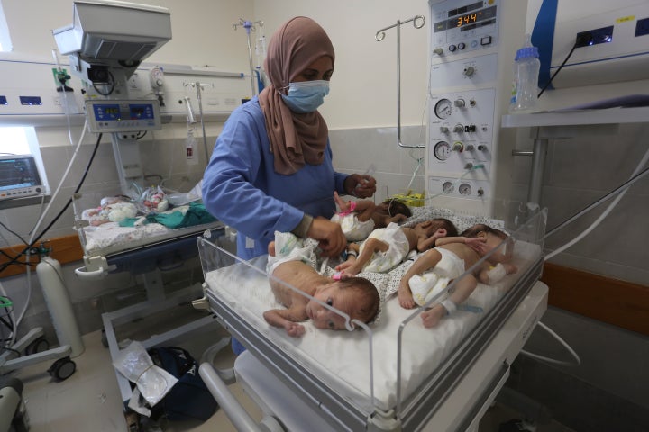 A nurse cares for prematurely born Palestinian babies that were brought from Shifa Hospital in Gaza City to the hospital in Rafah, Gaza Strip, Sunday, Nov. 19, 2023.