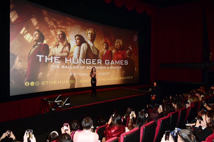 Olivia Rodrigo speaks onstage during a fan event for "The Hunger Games: The Ballad of Songbirds & Snakes," which earned $44 million at the box office.