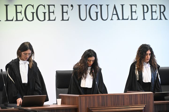 President of the court judge Brigida Cavasino, center, flanked by judges Claudia Caputo, left, and Germana Radice read the verdicts of a maxi-trial of hundreds of people accused of membership in Italy's 'ndrangheta organized crime syndicate, one of the world's most powerful, extensive and wealthy drug-trafficking groups, in Lamezia Terme, southern Italy, on Nov. 20, 2023.