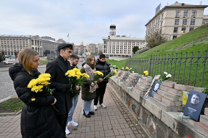 People gather by the memorial of Maidan activists in Kyiv on November 21, 2023.