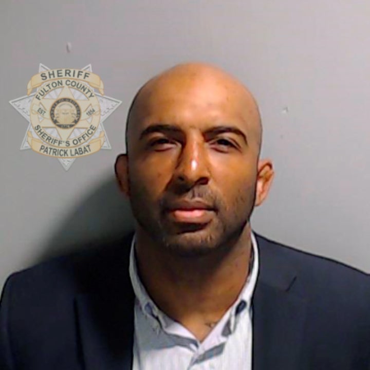 In a handout provided by the Fulton County Sheriff's Office, Black Voices for Trump leader Floyd Harrison poses for his booking photo on Aug. 24.