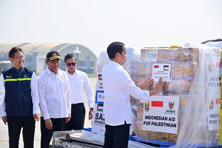 Indonesian President Joko Widodo (right) inspects humanitarian aid provided by the Indonesian government to the Palestinian people before departing Monday from Jakarta, Indonesia.