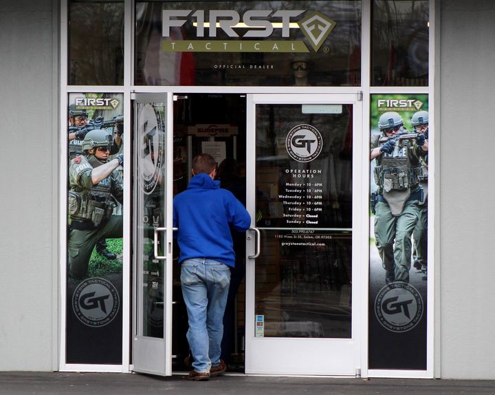 FILE - A man enters a gun shop in Salem, Ore., on Feb. 19, 2021. (AP Photo/Andrew Selsky, File)