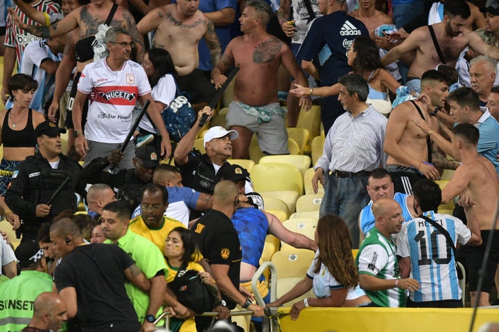 Fans of Argentina clash with Brazilian police before the start of the 2026 FIFA World Cup South American qualification football match between Brazil and Argentina at Maracana Stadium in Rio de Janeiro, Brazil, on November 21, 2023. (Photo by CARL DE SOUZA / AFP) (Photo by CARL DE SOUZA/AFP via Getty Images)