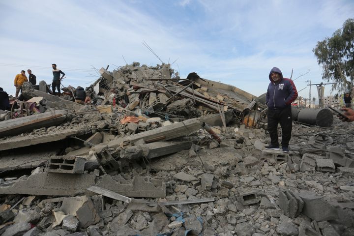 Palestinians look at destruction by the Israeli bombardment of the Gaza Strip in Rafah on Wednesday, Nov. 22, 2023.