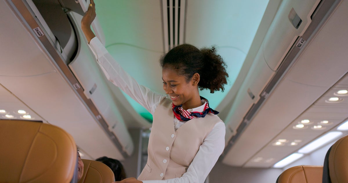 Why Do Flight Attendants Sit On Their Hands? - Vimarsana News