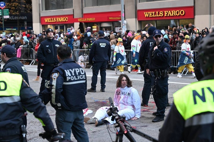 After demonstrators glued themselves to 6th Avenue, the parade was diverted around them.