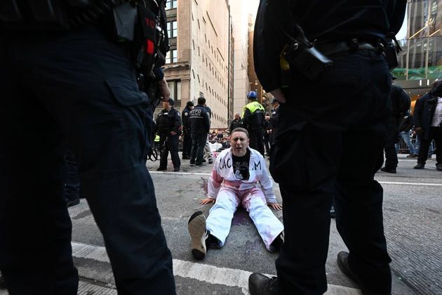 After demonstrators glued themselves to 6th Avenue, the parade was diverted around them.