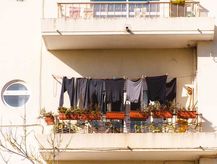 Clothes hanging outside in the balcony in Cascais, Lisbon, Portugal - November, 2023