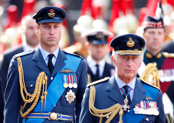 Prince William, Prince of Wales and King Charles walk behind Queen Elizabeth II's coffin as it is transported on a gun carriage from Buckingham Palace to the Palace of Westminster ahead of her lying-in-state on Sep.14, 2022.