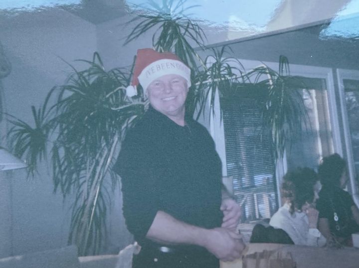 The author's father, Keith, wearing one of the family's many Santa hats.