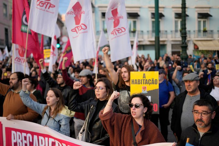 Demonstrators in Lisbon raise their fists during a Nov. 11 protest by workers' unions demanding, among other things, an increase of salaries and pensions. Days earlier, Portuguese President Marcelo Rebelo de Sousa announced he's dissolving the nation's Parliament and calling an early election two days after Prime Minister António Costa resigned amid a corruption scandal.