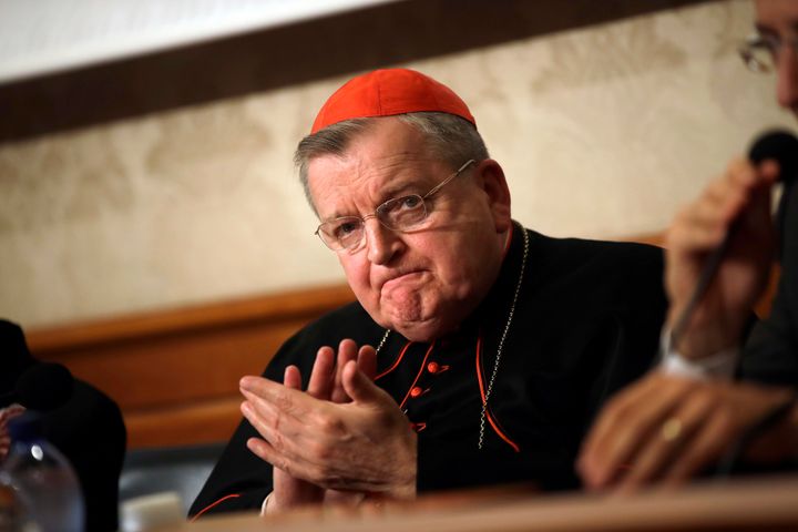 FILE - Cardinal Raymond Burke applauds during a news conference at the Italian Senate, in Rome, on Sept. 6, 2018. (AP Photo/Alessandra Tarantino, File)