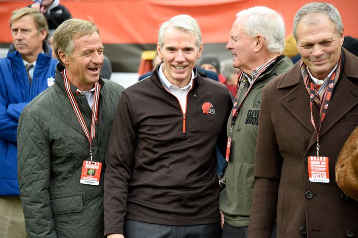 CLEVELAND, OHIO - NOVEMBER 24: Former Tennessee governor Bill Haslam (L), Ohio Republican Senator Rob Portman (C) and team owner Jimmy Haslam (2R) talk on the sidelines prior to the game against the Miami Dolphins at FirstEnergy Stadium on November 24, 2019 in Cleveland, Ohio. (Photo by Jason Miller/Getty Images)