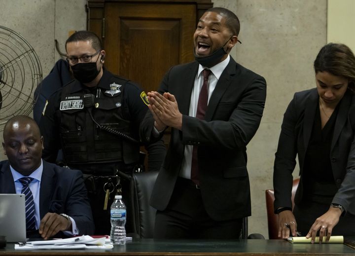 Actor Jussie Smollett, center, is seen speaking to the judge after his sentence was read in court on March 10, 2022, in Chicago.