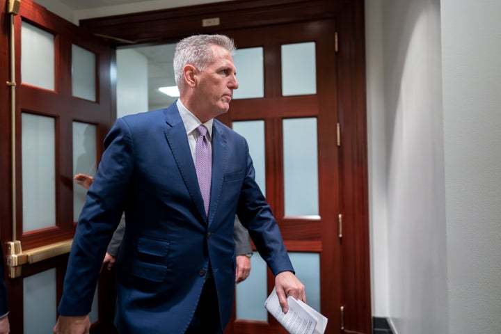 House Speaker Kevin McCarthy lugs notes from his Aug. 26 meeting with fellow Republicans on his debt ceiling package.