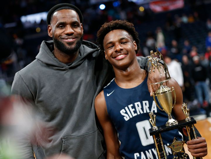 LeBron James (left) and LeBron “Bronny” James Jr. are seen after the teen's high school team won a basketball game, on Dec. 14, 2019, in Columbus, Ohio.