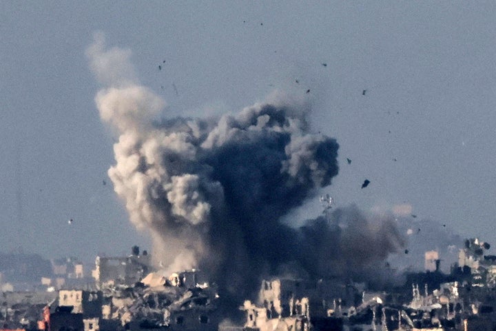 A picture taken from southern Israel near the border with the Gaza Strip on December 2, 2023, shows smoke billowing over the Palestinian territory during Israeli bombardment amid continuing battles between Israel and the militant group Hamas. (Photo by JACK GUEZ/AFP via Getty Images)