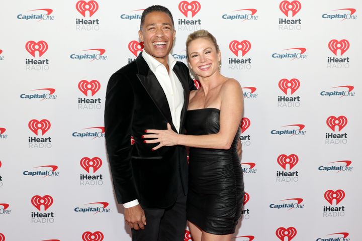 T.J. Holmes (left) and Amy Robach are photographed at iHeartRadio's Jingle Ball event on Friday in Inglewood, California.