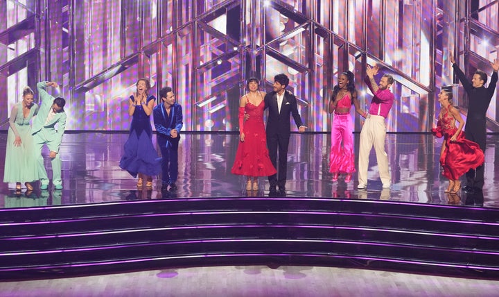 Mraz, far right, and Karagach react with fellow contestants after making it through the show's semifinals.