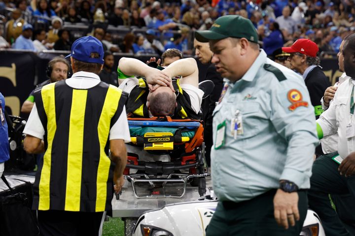 Nick Piazza was wheeled off during the first half of the NFL football game between the New Orleans Saints and the Detroit Lions.