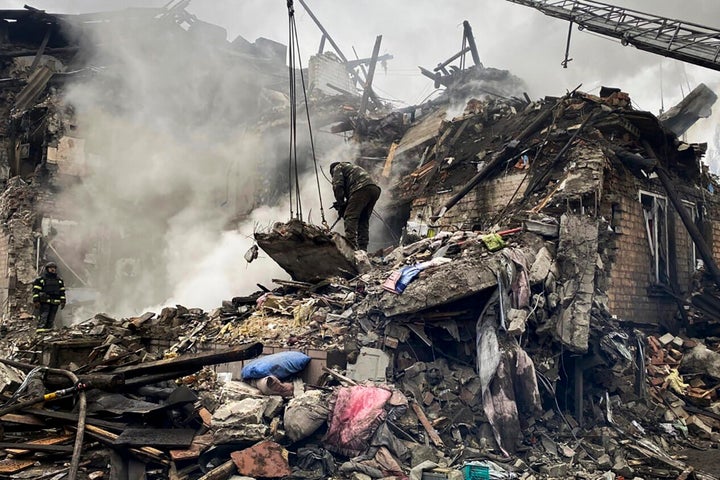 Rescuers work at the scene of a building damaged by shelling in Novogrodivka, Ukraine, on Nov. 30, 2023.
