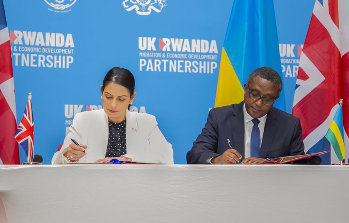  Home Secretary of the United Kingdom Priti Patel (L) and Rwandan Foreign Minister Vincent Biruta (R) sign an agreement on "Migration and Economic Development Partnership Agreement" inn Kigali, Rwanda on April 14, 2022.