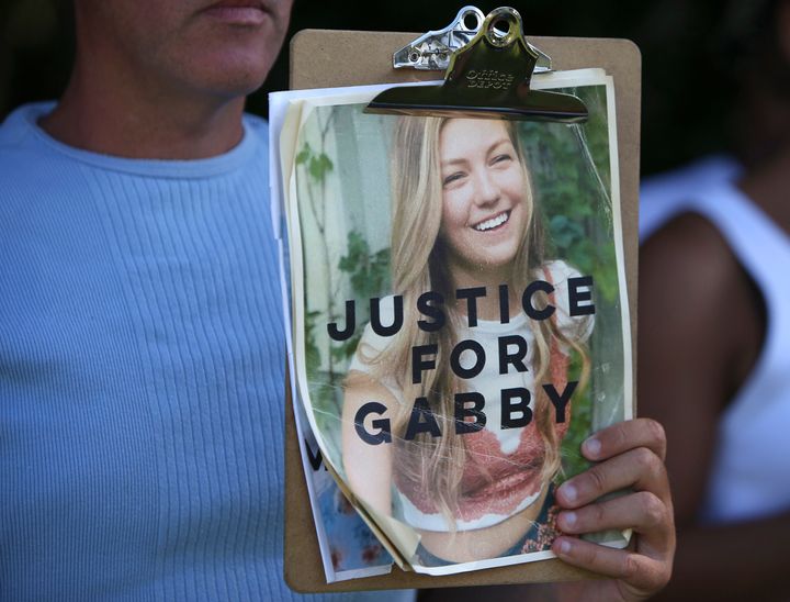 Supporters of "Justice for Gabby" gathered at the entrance of a park in Florida where Brian Laundrie's remains were found on Oct. 20, 2021. Gabby Petito's online chronicle of her "van life" trip with Laundrie attracted wide interest in her disappearance and death.