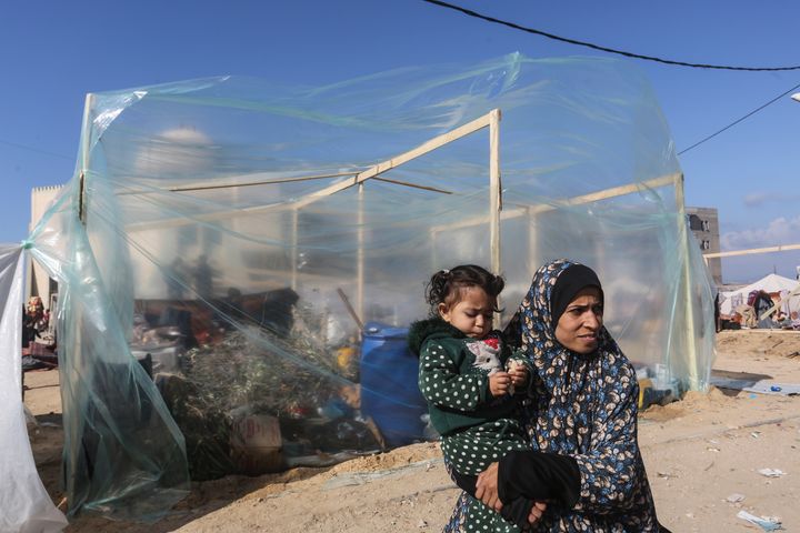 Palestinians displaced by the Israeli bombardment of the Gaza Strip set up a tent camp in Rafah on Dec. 6, 2023.