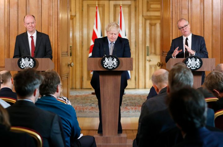 Boris Johnson, centre, Chief Medical Officer for England Chris Whitty, left, and then Chief Scientific Adviser Patrick Vallance 