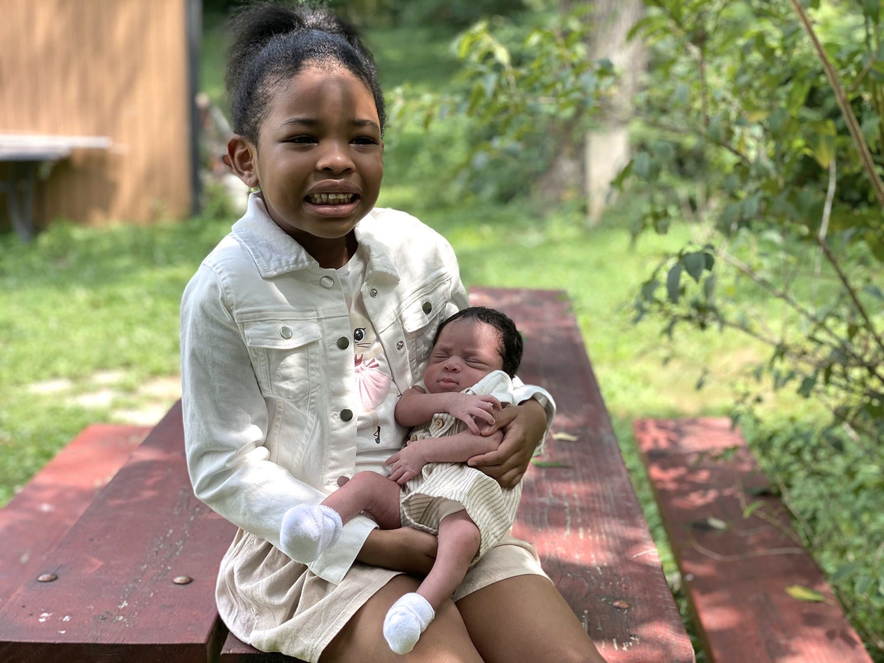 Coleman’s daughters pose for a family portrait at a park in Gaithersburg, Maryland, in 2020. Coleman felt that much of his treatment throughout his second pregnancy was motivated more because of racism than because of transphobia.