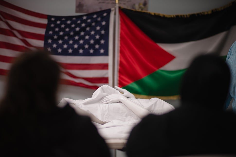 A wrapped mannequin on a table during a demonstration by Khalil at Beit Anan Community Center.