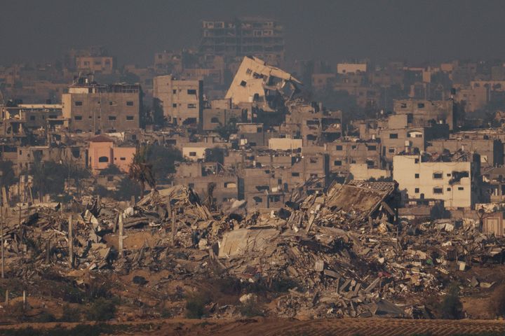 Destroyed buildings from Israeli airstrike are seen in the northern Gaza Strip, as seen from southern Israel, Thursday, Dec. 7, 2023. (AP Photo/Leo Correa)