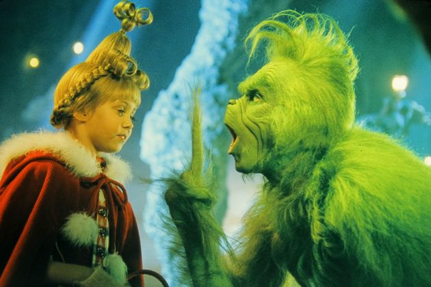 Jim Carrey with a young Taylor Momsen in The Grinch