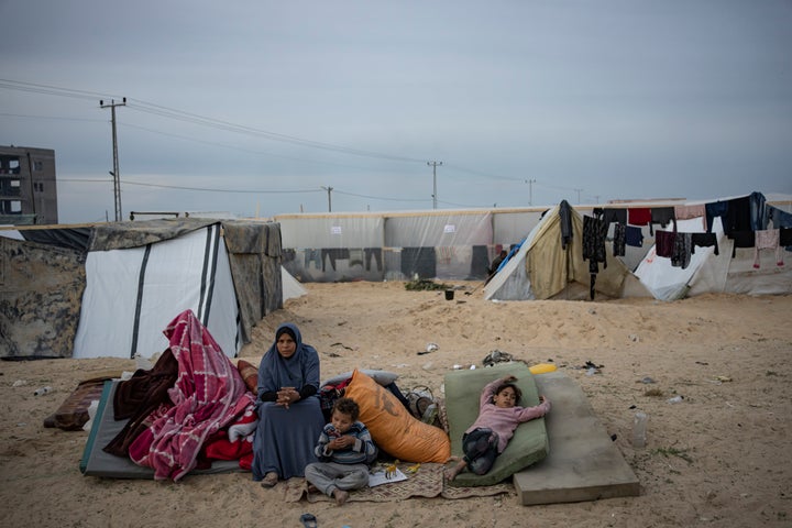 Palestinians displaced by the Israeli ground offensive on the Gaza Strip arrive in the Muwasi area Thursday, Dec. 7, 2023.