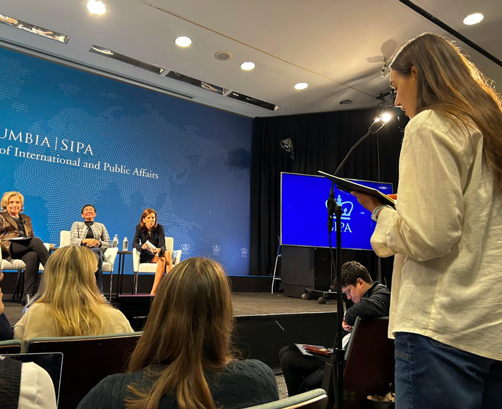 The author (right) posing a question to Clinton (on stage left), Maria Ressa (on stage center) and Yarhi-Milo (on stage right) at Columbia University in 2023.