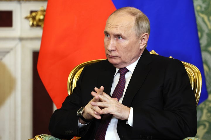 Russian President Vladimir Putin attends a meeting Thursday with Iranian President Ebrahim Raisi at the Kremlin in Moscow.
