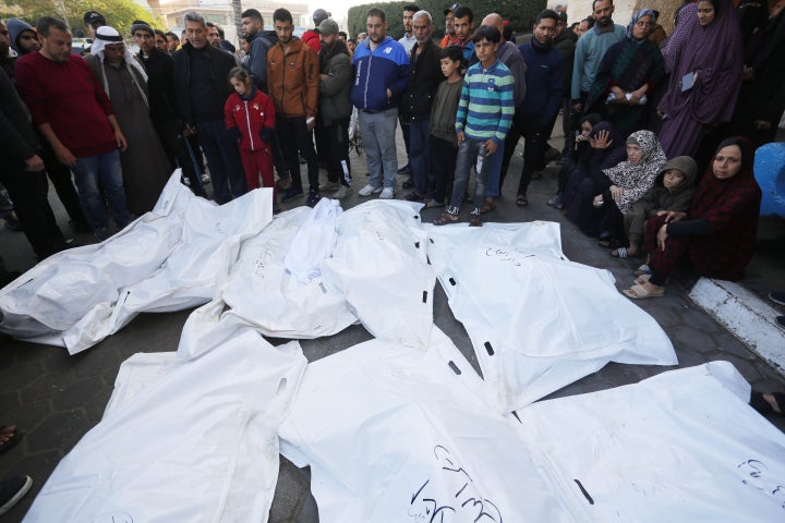 Relatives of dead Palestinians mourn at the Al-Aqsa Martyrs Hospital as the Israeli attacks continue in December in Deir Al-Balah, in the Gaza Strip. A report by Amnesty International says Israel used U.S. weapons to kill dozens of civilians in this neighborhood.