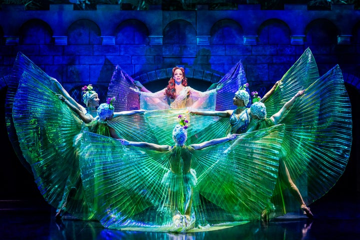 Leslie Rodriguez Kritzer with the ensemble cast of