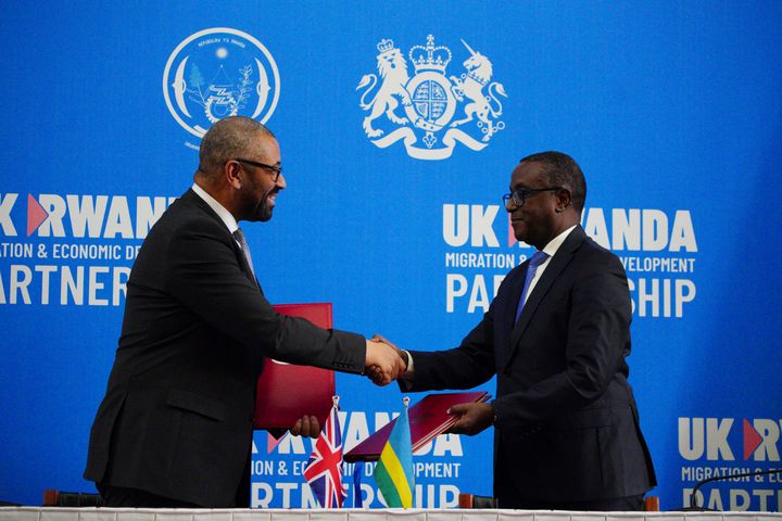 Home secretary James Cleverly, left, and Rwandan minister of foreign affairs Vincent Biruta shake hands after signing a new treaty in Kigali, Rwanda.