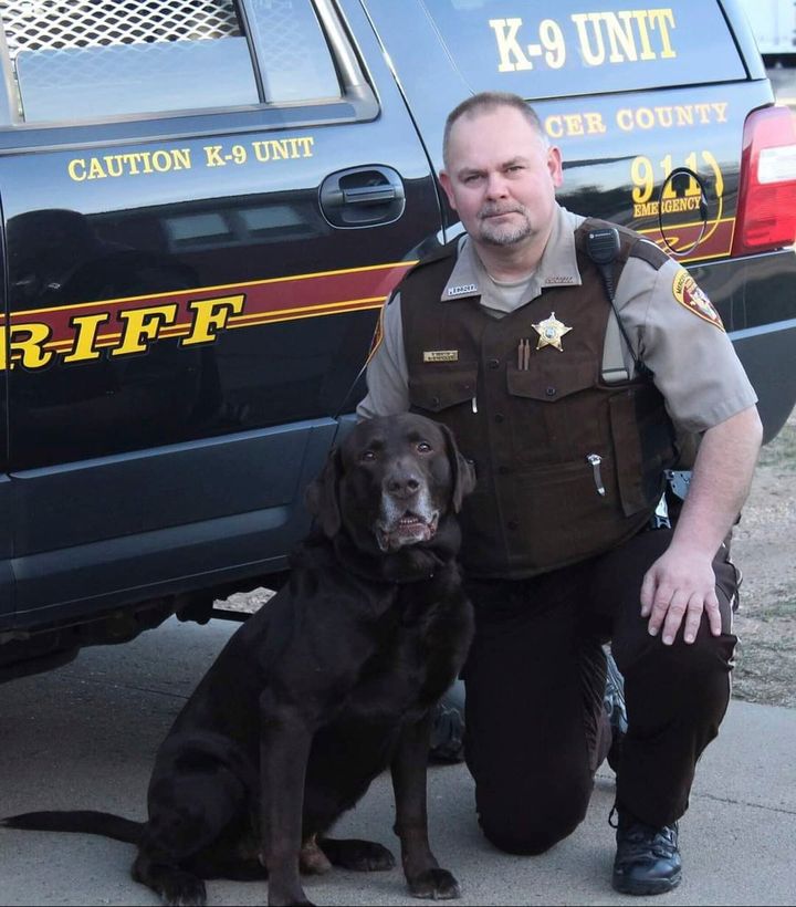 This undated photo provided by the Mercer County, N.D., Sheriff's Office shows Sheriff's Deputy Paul Martin with his retired K9 Goliath, who died in 2019. Martin, 53, died Wednesday, Dec. 6, 2023, in a crash involving Ian Cramer, the 42-year-old son of Republican U.S. Sen. Kevin Cramer of North Dakota.