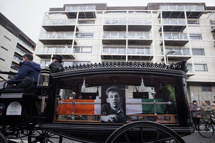 The funeral procession of Shane MacGowan makes its way along Pearse Street in Dublin ahead of his funeral in Tipperary.