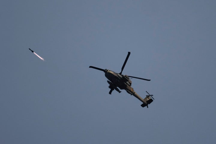 Israeli attack helicopter shoots a missile over the Gaza Strip on Saturday, Dec. 9, 2023. (AP Photo/Leo Correa)