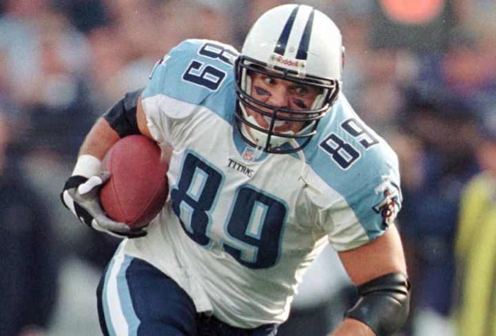 Tennessee Titans tight end Frank Wycheck runs with the ball during a football game against the Baltimore Ravens, Dec. 5, 1999, in Baltimore. The three-time Pro Bowler Wycheck, who threw the lateral that started the “Music City Miracle” launching the Tennessee Titans' run to the franchise's lone Super Bowl appearance, has died at age 52. (AP Photo/Roberto Borea, File)