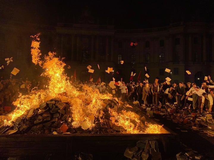 For one of its most visually stunning scenes, "Origin" recollects the 1930s Nazi book burnings in Germany.