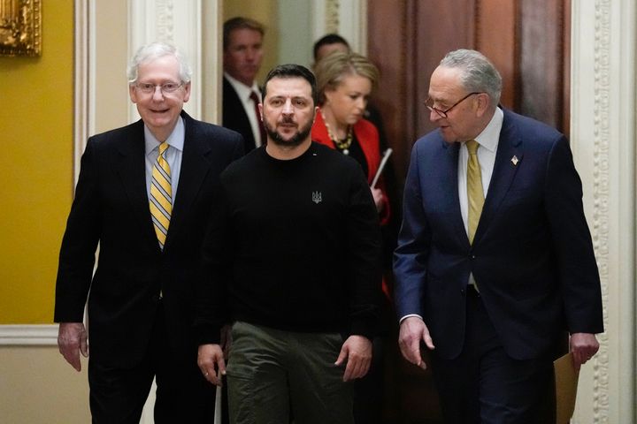 Ukrainian President Volodymyr Zelenskyy walks with Senate Majority Leader Chuck Schumer of N.Y., and Senate Minority Leader Mitch McConnell of Ky., during a visit to Capitol Hill in Washington, on Dec. 12, 2023. 