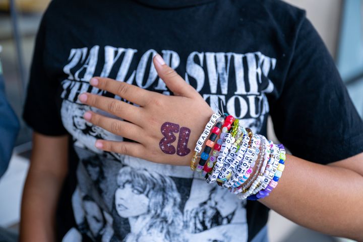 A Taylor Swift fan wears stacks of friendship bracelets on Oct. 13, 2023.