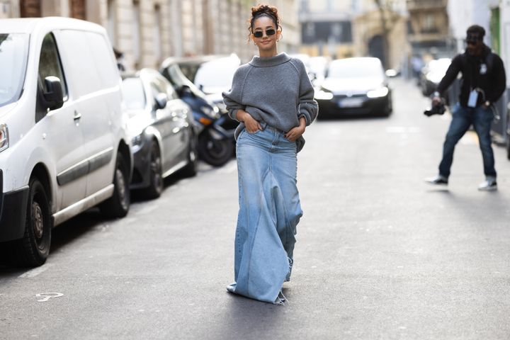 Léna Mahfouf wears a long denim skirt outside the Victoria Beckham show at Paris Fashion Week in September. 