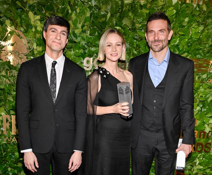 From left: Gideon Glick, who plays Tommy Cothran in "Maestro"; Carey Mulligan, who plays Felicia Montealegre; and Bradley Cooper, who plays Bernstein, pose in New York on Nov. 27.