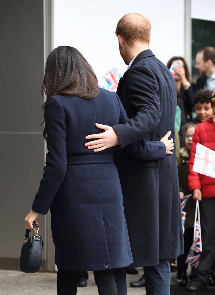 Meghan Markle wore a J.Crew coat that still had its back vent tacking stitch on a visit to Birmingham, England, in March 2018.
